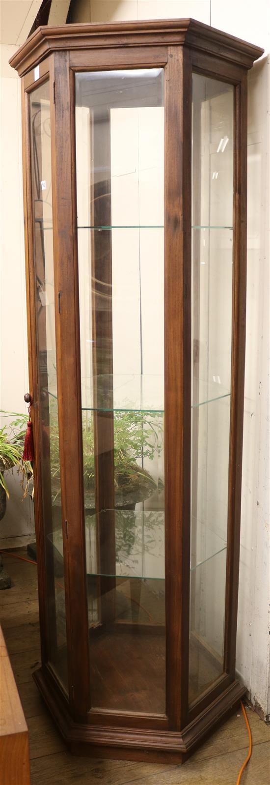 A stained beech framed hexagonal display cabinet, with four shelves W.73cm